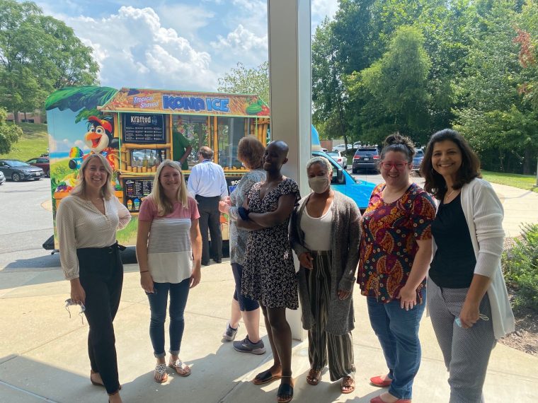 Girls standing in front of Kona Ice Stall