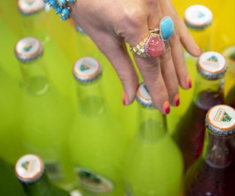 Bottled drinks and hand with rings