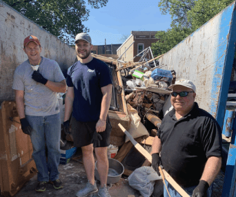 volunteer 342x285 (2)-min volunteer taking picture at garbage area
