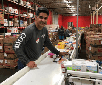 volunteer 342x285 (4)-min volunteer doing packaging